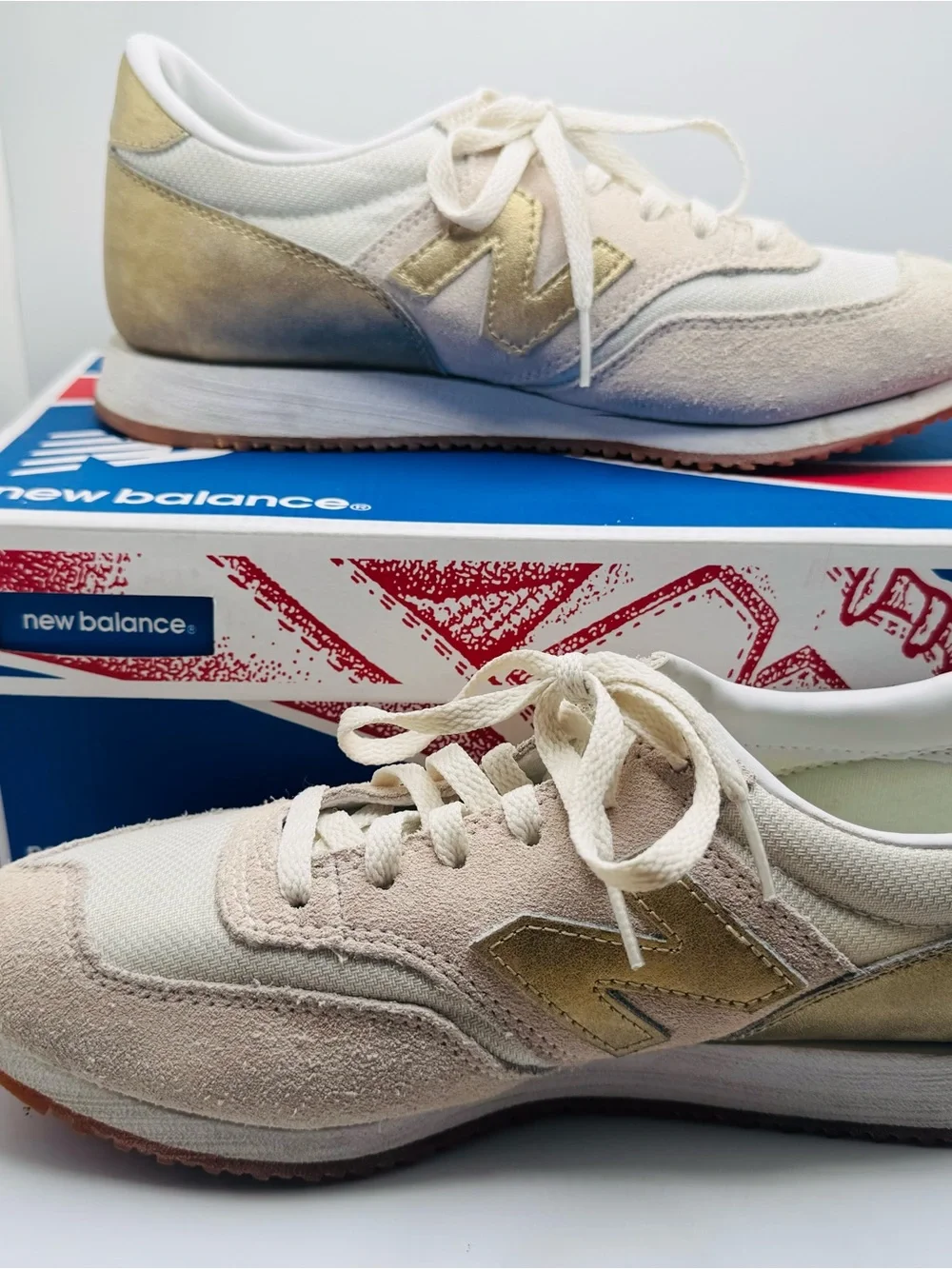 New Balance Women’s White Sneakers with Gold Accents